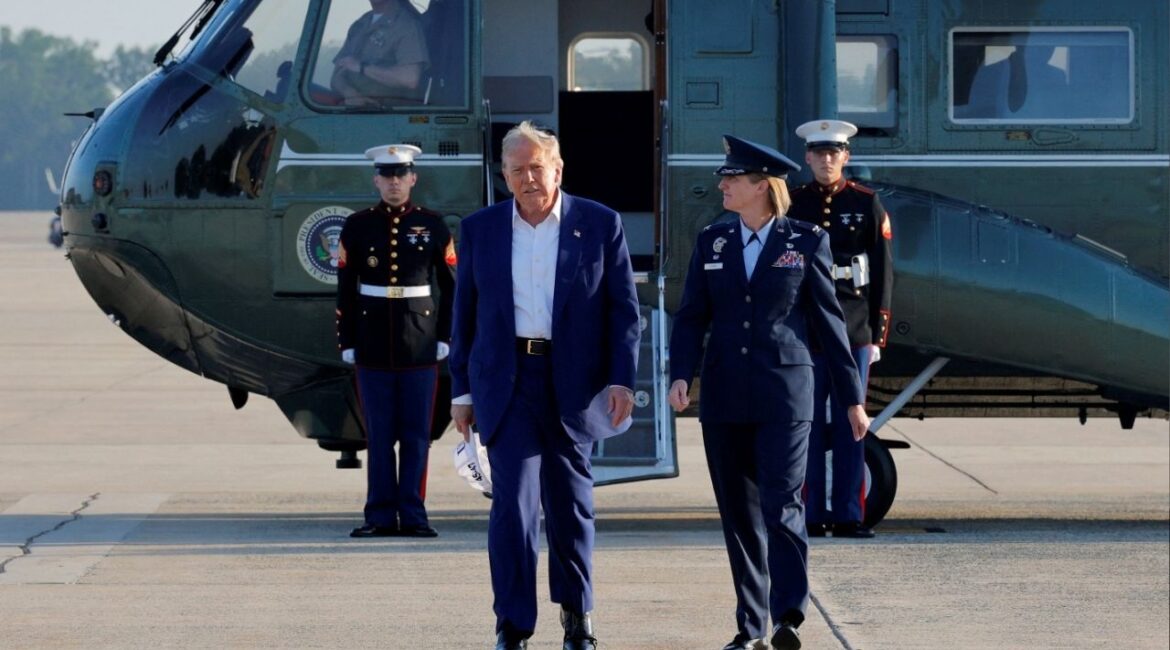 President Donald Trump walks with Air Force Commander Colonel Angela Ochoa after stepping off Marine One to board Air Force One to depart for the NATO summit in The Hague, Netherlands, at Joint Base Andrews, Maryland, U.S., June 24, 2025. (Reuters/Brian Snyder)