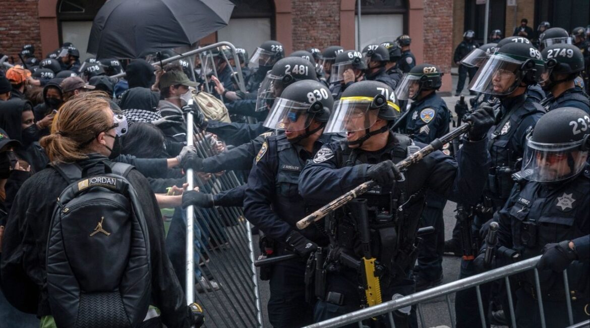 Protesters confront police near a U.S. Immigration and Customs Enforcement facility in San Francisco on Sunday, June 8, 2025. In Los Angeles, federal agents clashed with protesters near an immigration detention center as confrontations there stretched into a third day. (Loren Elliott/The New York Times)