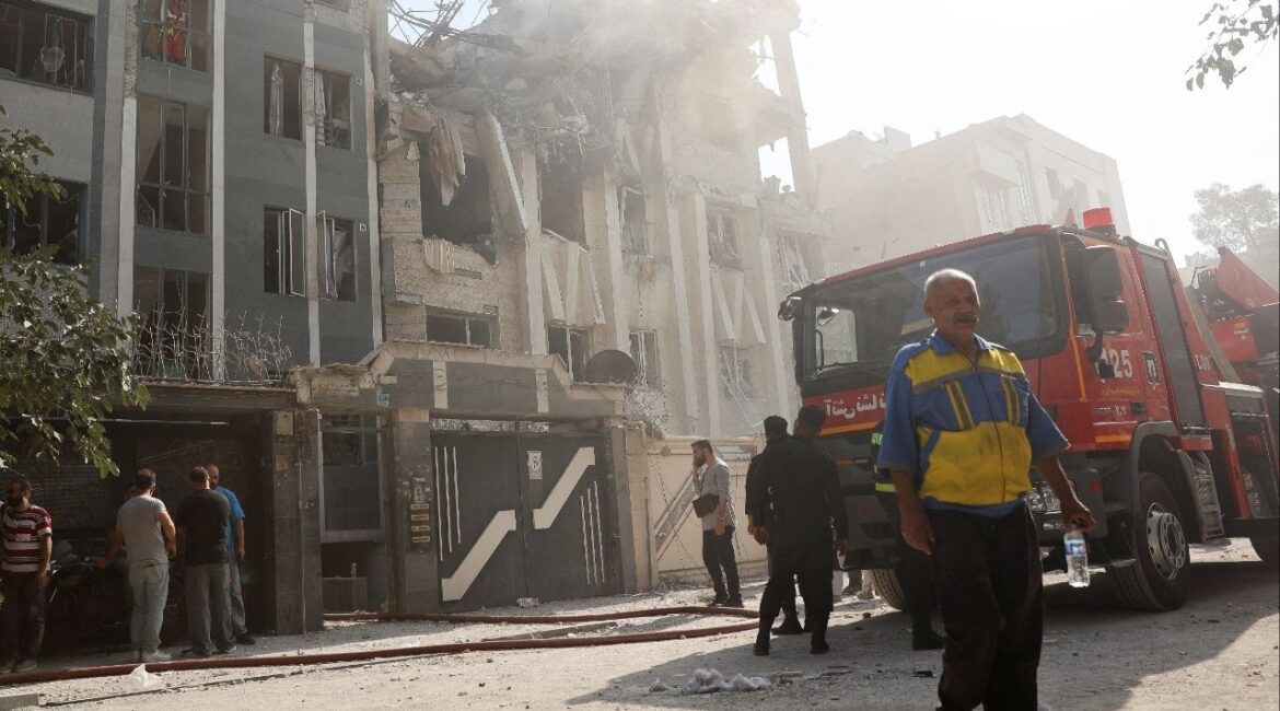 Rescuers work at the scene of a damaged building in the aftermath of Israeli strikes, in Tehran, Iran, June 13, 2025. Majid Asgaripour/WANA (West Asia News Agency) via REUTERS