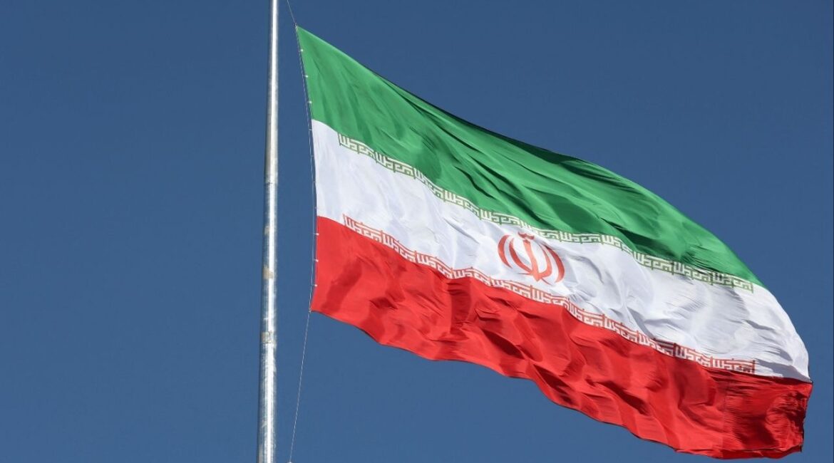 The Iranian flag is seen flying over a street in Tehran, Iran, February 3, 2023. Majid Asgaripour/WANA (West Asia News Agency) via REUTERS/ File Photo