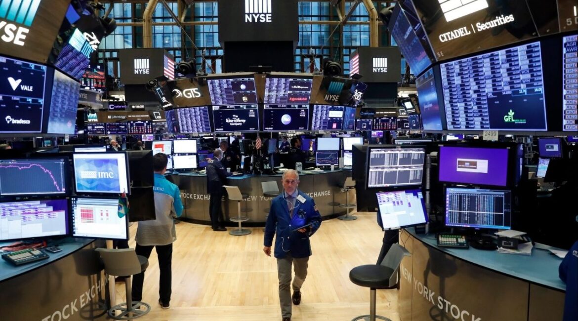Traders work on the floor of the New York Stock Exchange (NYSE) in New York, U.S., March 19, 2020. (Reuters File)