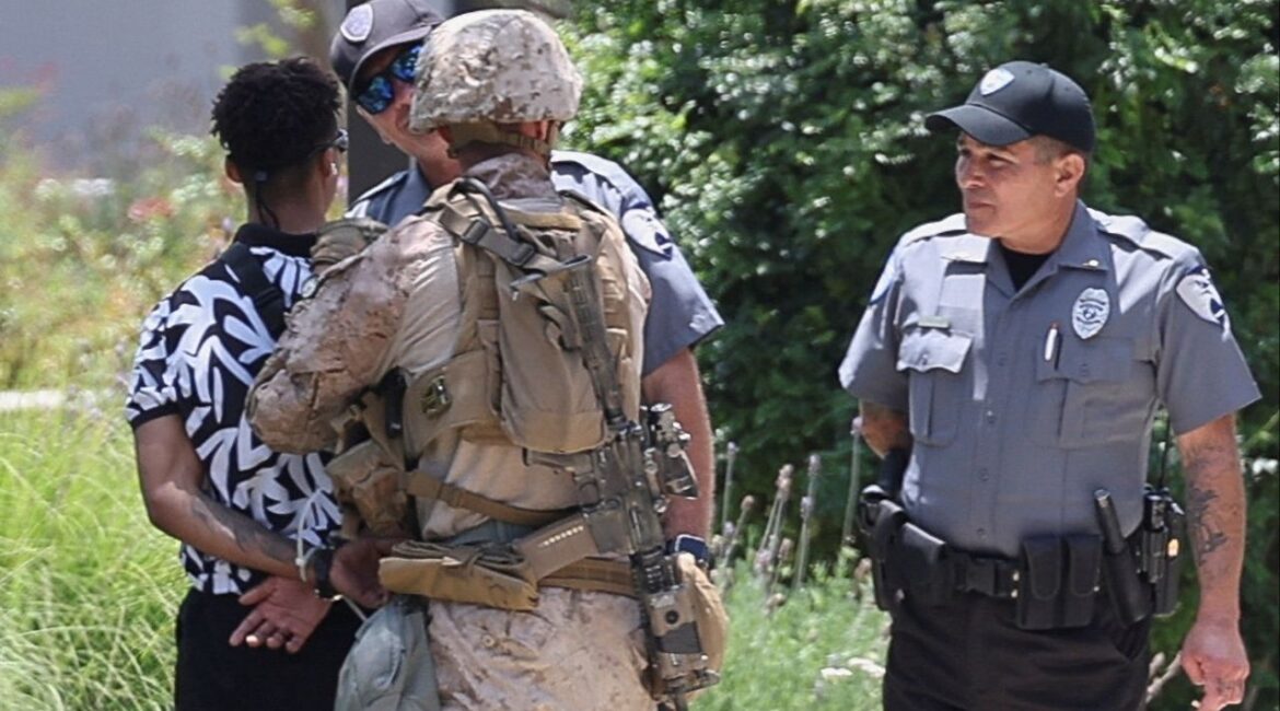 U.S. Marines detain a person outside the Wilshire Federal Building after Marines were deployed to Los Angeles, as protests against federal immigration sweeps continue, in Los Angeles, California, U.S. June 13, 2025. (Reuters/Aude Guerrucci)