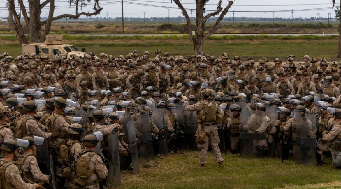 U.S. Marines with 2nd Battalion, 7th Marine Regiment, 1st Marine Division, who were placed in an alert status over the weekend, are briefed by battalion leadership while rehearsing crowd control tactics at a base in the greater Los Angeles area, California, U.S. June 10, 2025. U.S. Marine Corps/Cpl. Logan Courtright/Handout via REUTERS