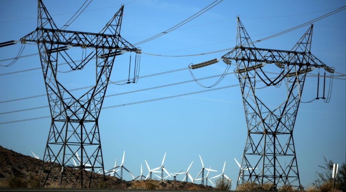 Windmills are seen behind electricity pylons in Palm Springs, California, U.S., November 25, 2017. (Reuters File)
