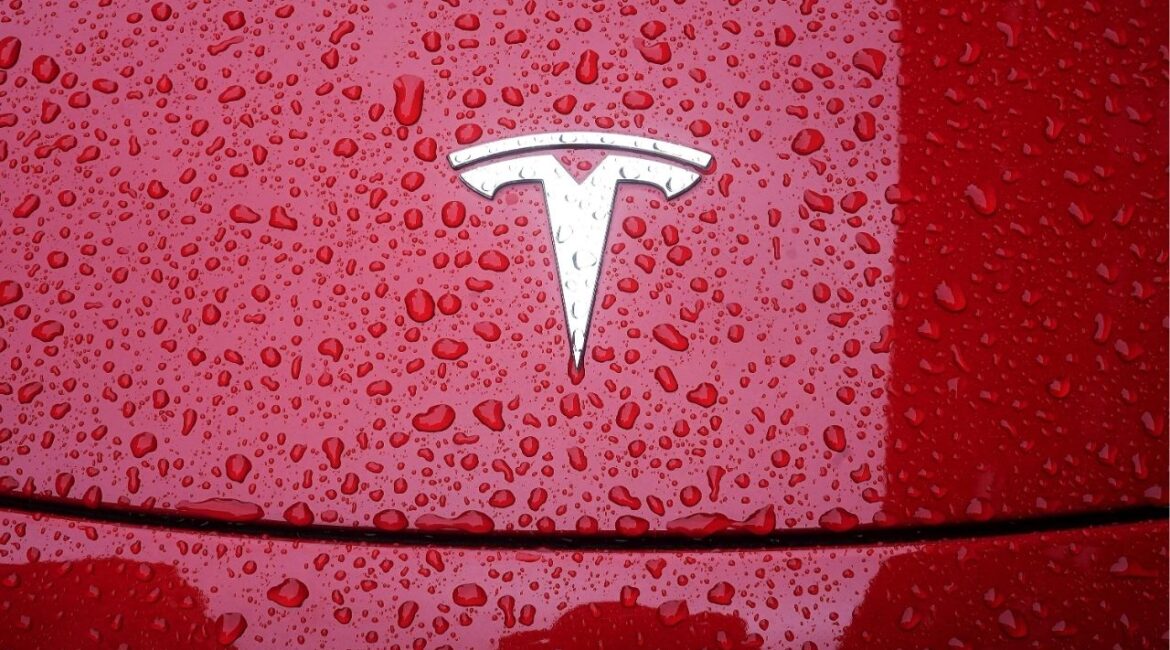 A Tesla logo is pictured on a car in the rain in the Manhattan borough of New York City, New York, U.S., May 5, 2021. (Reuters File)