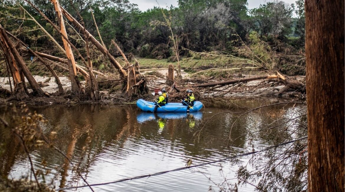A group of search and rescue workers paddle a boat in the Guadalupe River in the aftermath of deadly flooding in Kerr County, Texas, U.S., July 7, 2025. (Reuters/Sergio Flores)