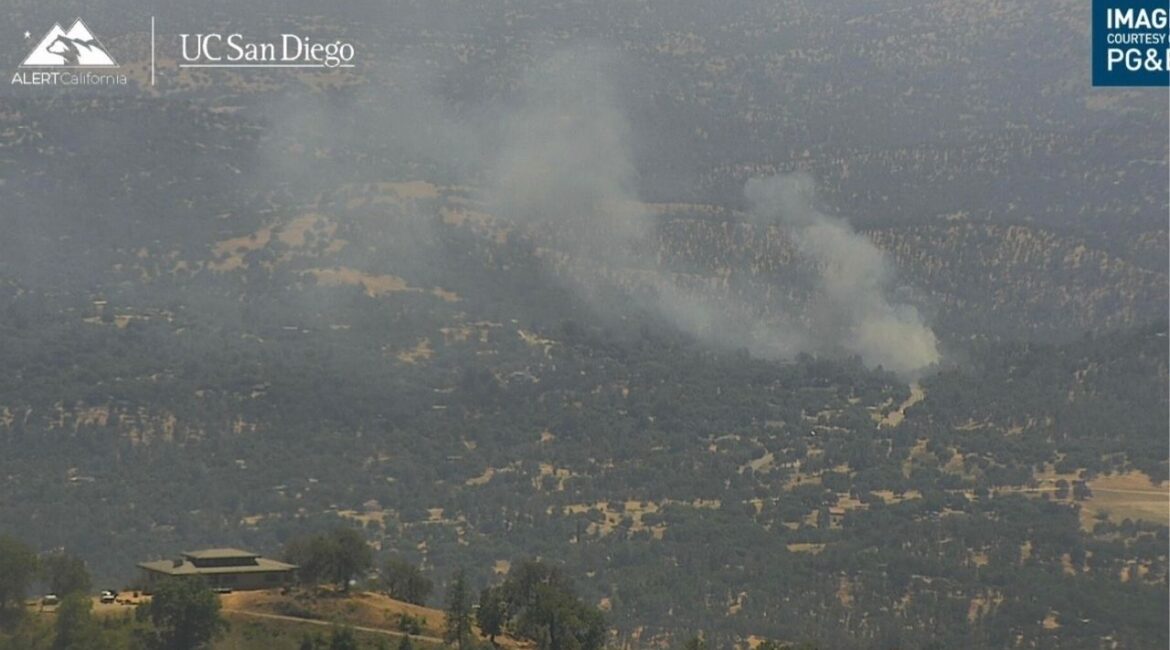 A structure fire in Coarsegold has spread to nearby vegetation, prompting road closures and evacuation warnings for multiple zones in Madera County. (Madera County SO)