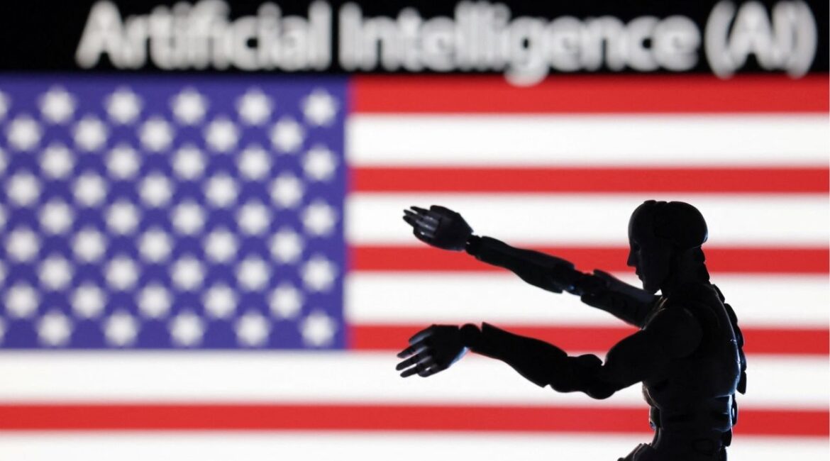 AI Artificial intelligence words, miniature of robot and U.S. flag are seen in this illustration taken December 21, 2023. (Reuters/Dado Ruvic/Illustration)