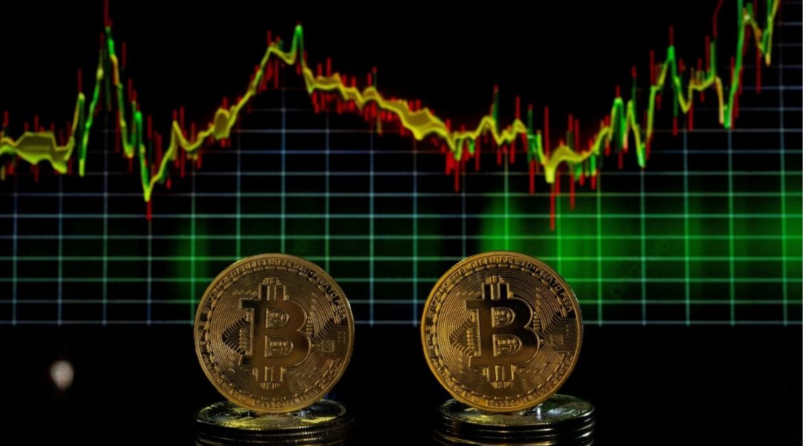 Bitcoin tokens and a price chart are seen in this illustration picture taken November 21, 2024. (Reuters File)