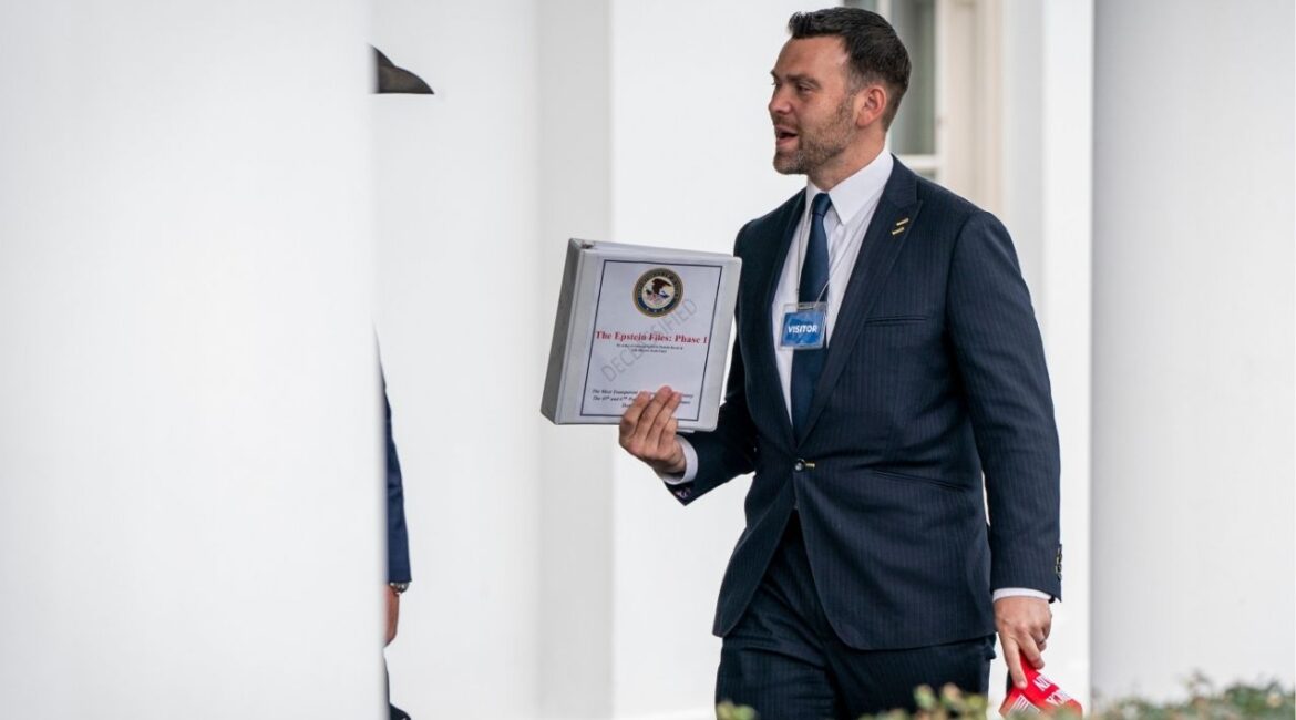 Jack Posobiec, a far-right political activist, carries a binder labeled “The Epstein Files: Phase 1” as he exits the White House in Washington, Feb. 27, 2025. Here’s what to know about the disturbing facts and unsubstantiated suspicions that make Jeffrey Epstein, a registered sex offender, a politically potent obsession. (Haiyun Jiang/The New York Times)
