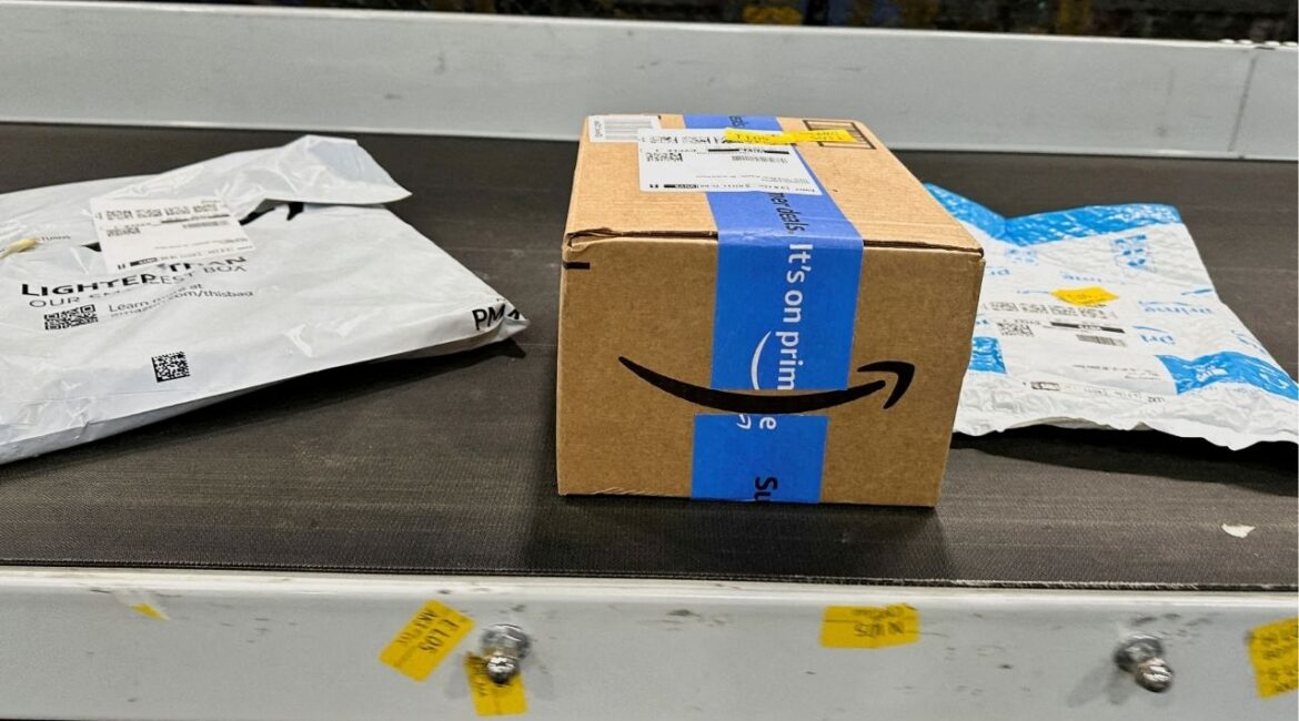 Packages are transported on a conveyor belt at the Amazon warehouse on Prime Day, in Melville, New York, U.S., July 11, 2023. (Reuters File)