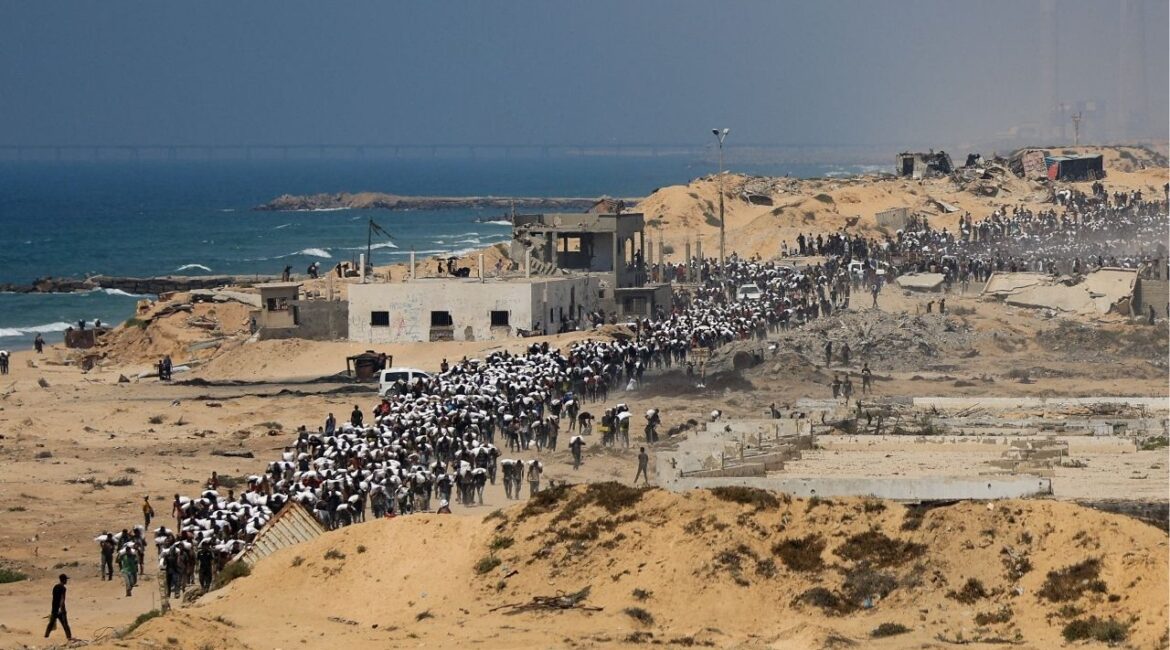Palestinians carry aid supplies that entered Gaza through Israel, in Beit Lahia in the northern Gaza Strip, July 27, 2025. (Reuters/Dawoud Abu Alkas)