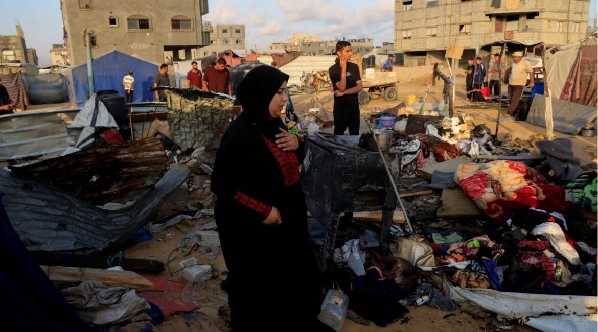 Palestinians inspect the damage at the site of an overnight Israeli air strike on a tent sheltering displaced people, in Khan Younis, southern Gaza Strip, July 2, 2025. REUTERS/Hatem Khaled TPX IMAGES OF THE DAY