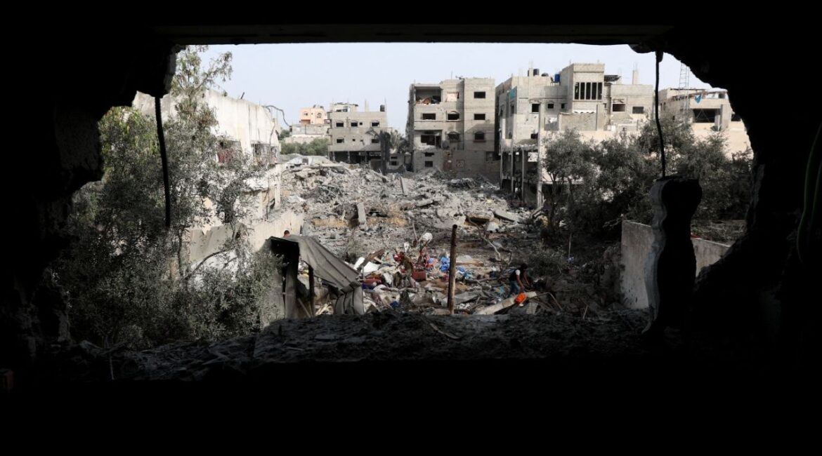 Palestinians inspect the site of an Israeli strike on a house that took place on Monday, in Zawayda in the central Gaza Strip, July 1, 2025. (Reuters/Ramadan Abed)