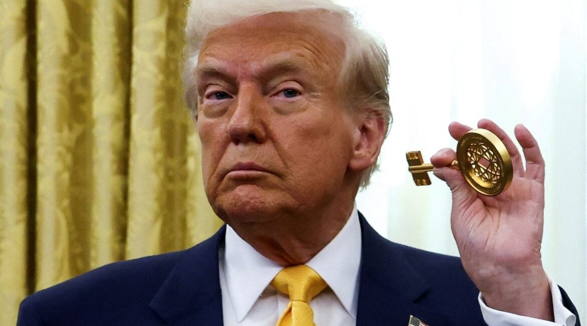 President Donald Trump holds the key to the FIFA Club World Cup trophy in the Oval Office of the White House in Washington, D.C., U.S., March 7, 2025. (Reuters File)