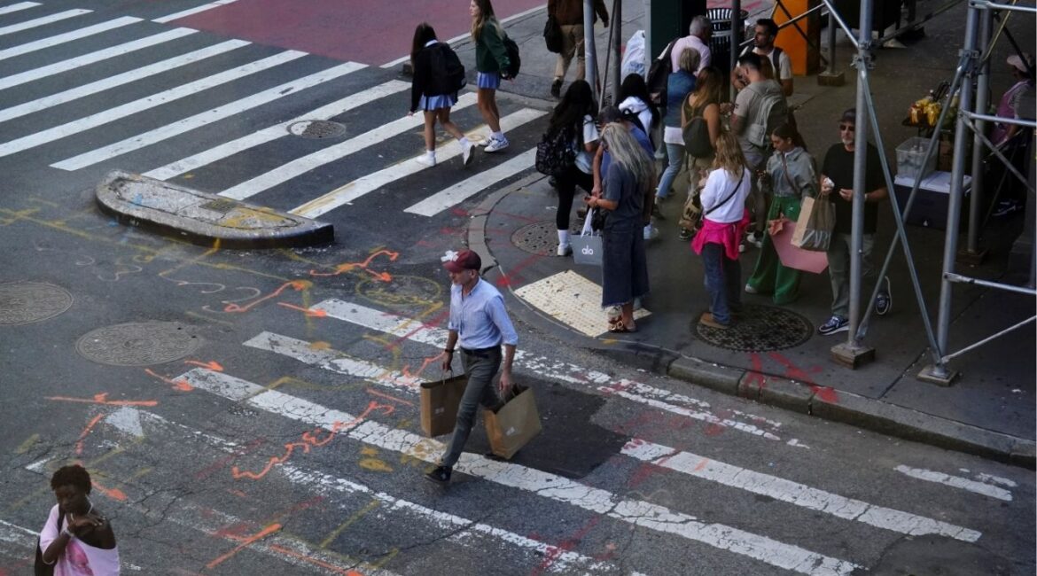 Shoppers cross the intersection of Broadway and Spring Street in the SoHo neighborhood of New York City, U.S., September 21, 2023. (Reuters File)