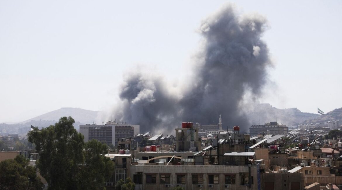 Smoke rises from a building after strikes at Syria's defense ministry in Damascus, Syria, July 16, 2025. (Reuters/Khalil Ashawi)
