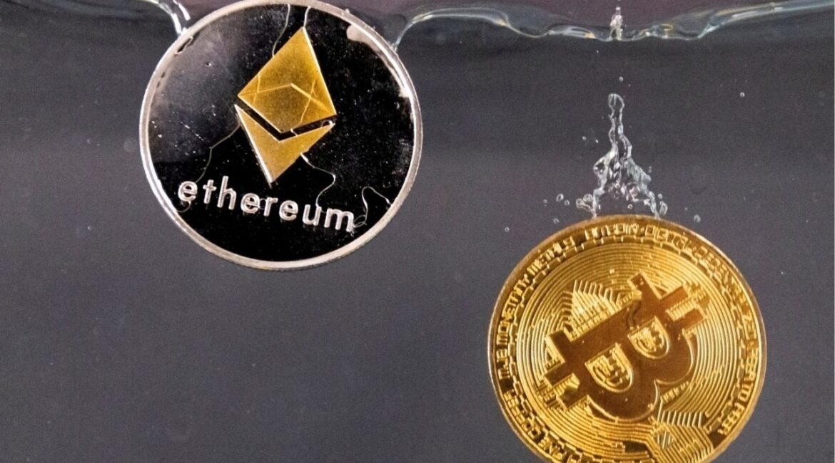 Souvenir tokens representing cryptocurrency Bitcoin and the Ethereum network, with its native token ether, plunge into water in this illustration taken May 17, 2022. (Reuters File)