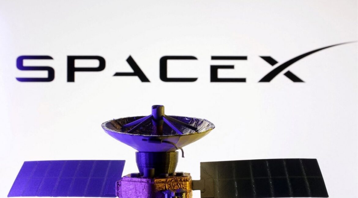 SpaceX logo and miniature satellite model are seen in this illustration taken, March 10, 2025. (Reuters File)