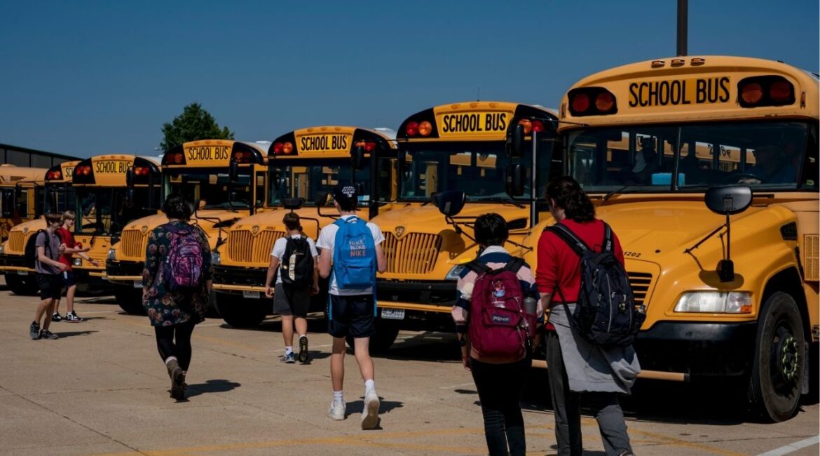 Students head to the buses at the end of the day at a high school in Cedar Hill, Mo., on Sept. 14, 2022. The White House will release $5.5 billion in frozen education funds, administration officials announced on Friday, July 25, bringing an end to a chaotic saga of the administration’s making, which had sent school districts scrambling with weeks to go before the school year. (Whitney Curtis/The New York Times)