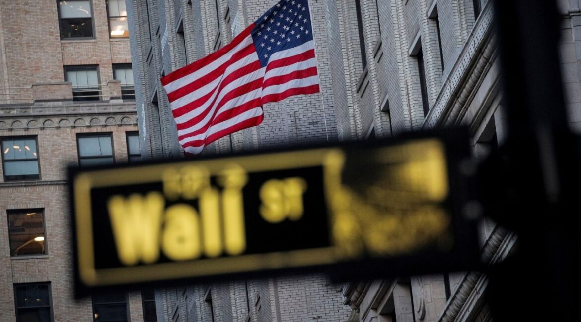 The U.S. flag is seen on a building on Wall St. in the financial district in New York, U.S., November 24, 2020. (Reuters File)
