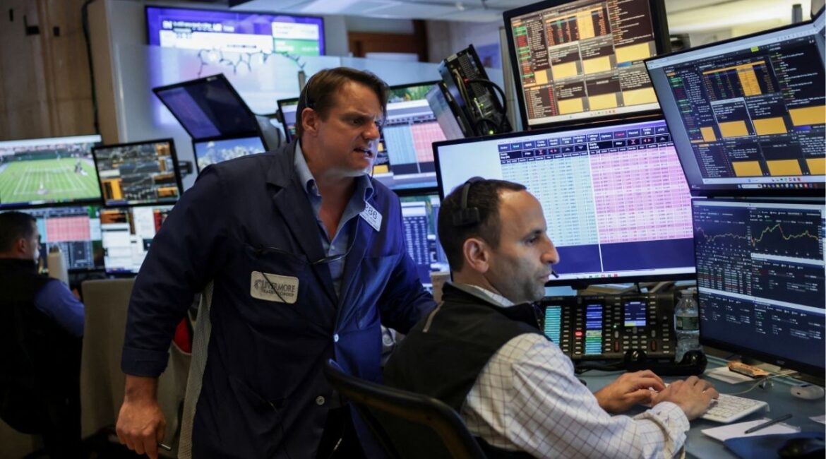 Traders work on the floor at the New York Stock Exchange (NYSE) in New York City, U.S., July 1, 2025. (Reuters/Jeenah Moon)