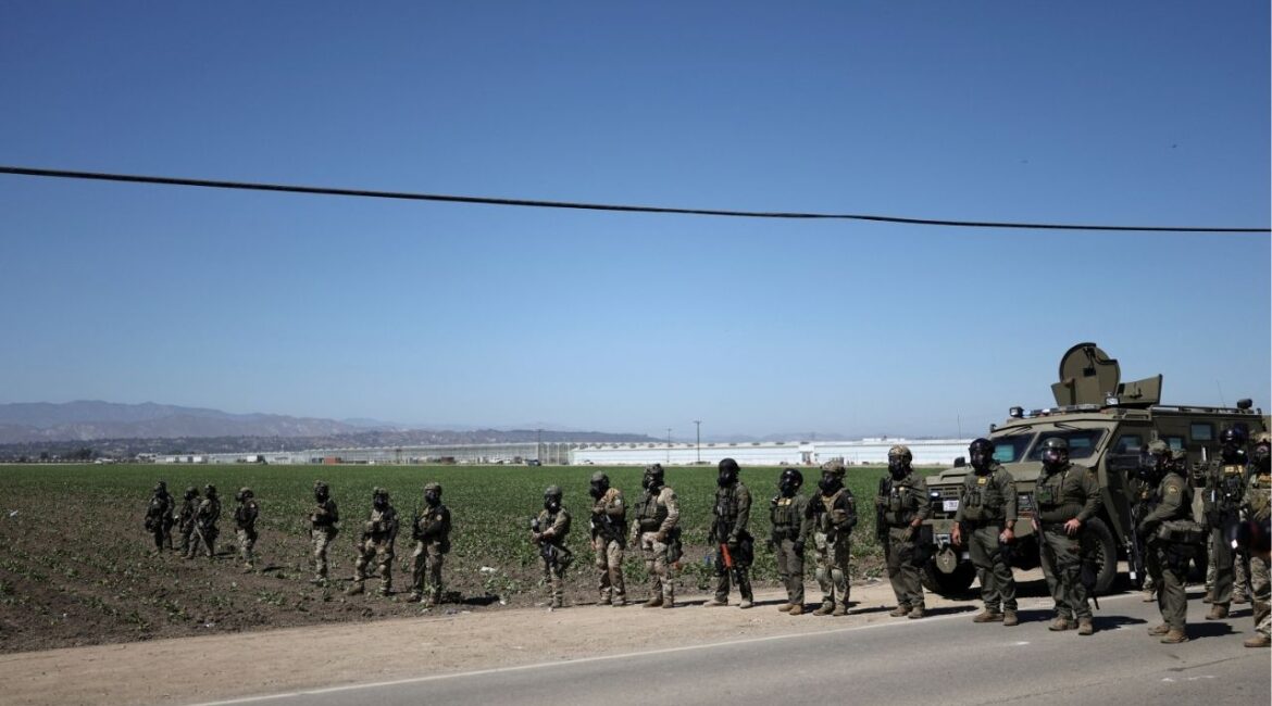 U.S. federal agents block a road leading to an agricultural facility where U.S. federal agents and immigration officers conducted an operation, in Camarillo, California, U.S., July 10, 2025. (Reuters/Daniel Cole)