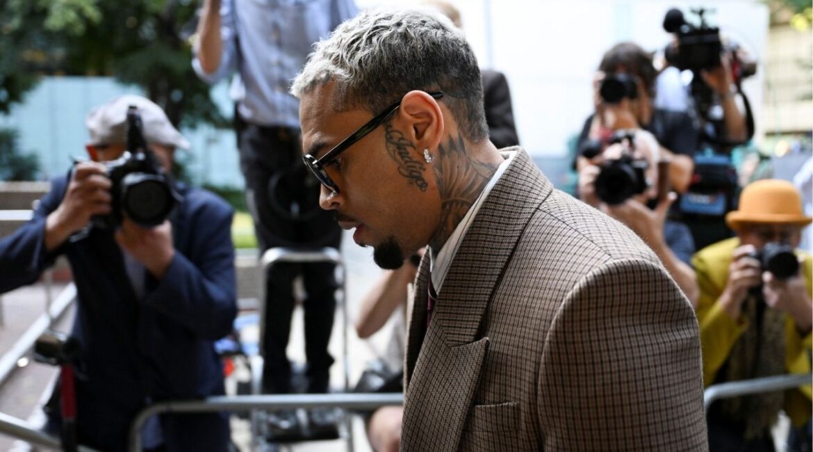 U.S. singer Chris Brown, who has been charged with inflicting grievous bodily harm in what prosecutors said was an "unprovoked attack" on a music producer at the Tape nightclub in central London in 2023, walks outside the Southwark Crown Court in London, Britain, July 11, 2025. (Reuters/Chris J. Ratcliffe)