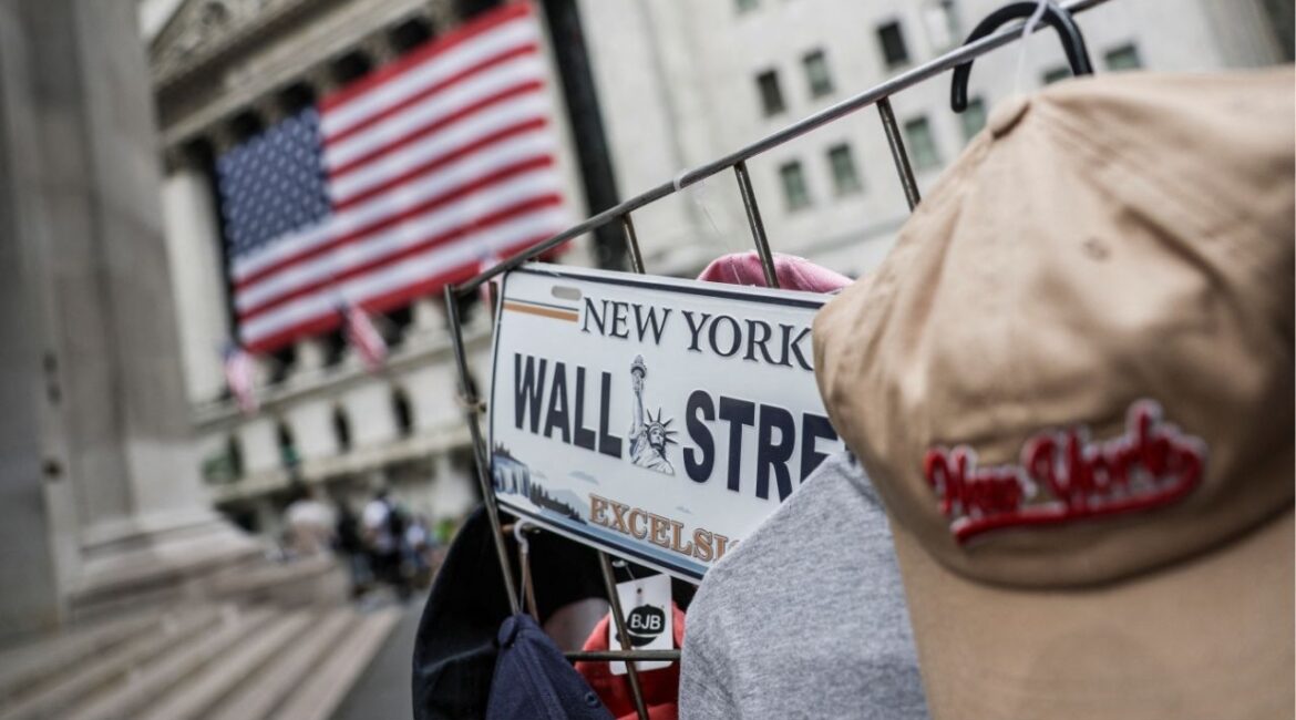 A Wall Street plate is seen on a street vendor stall outside the New York Stock Exchange (NYSE) in New York City, U.S., July 11, 2025. (Reuters/Jeenah Moon)