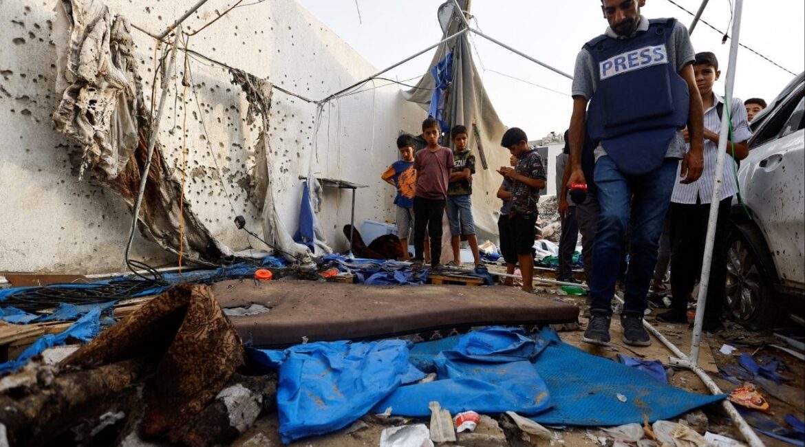 A member of the media inspects the damage at the site of an Israeli strike on a tent near Shifa Hospital, in Gaza City August 11, 2025. (Reuters File)