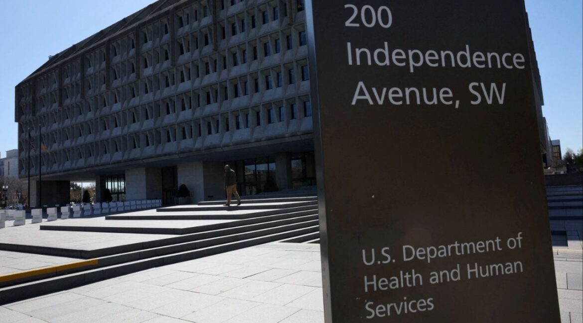 A person walks outside of the U.S. Department of Health and Human Services building after it was reported that the HHS will cut about 10,000 full-time jobs and close half of its regional offices, a major overhaul of the department under Health Secretary Robert F. Kennedy Jr., in Washington, D.C., U.S., March 27, 2025. (Reuters File)