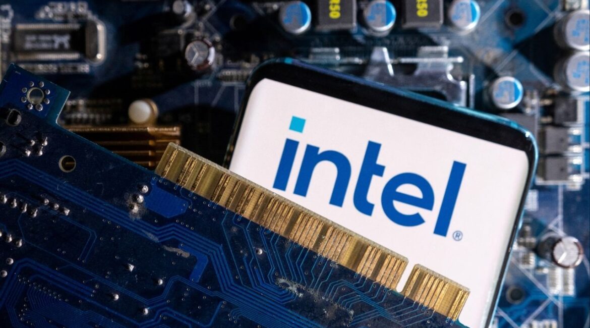 A smartphone with a displayed Intel logo is placed on a computer motherboard in this illustration taken March 6, 2023. (Reuters File)