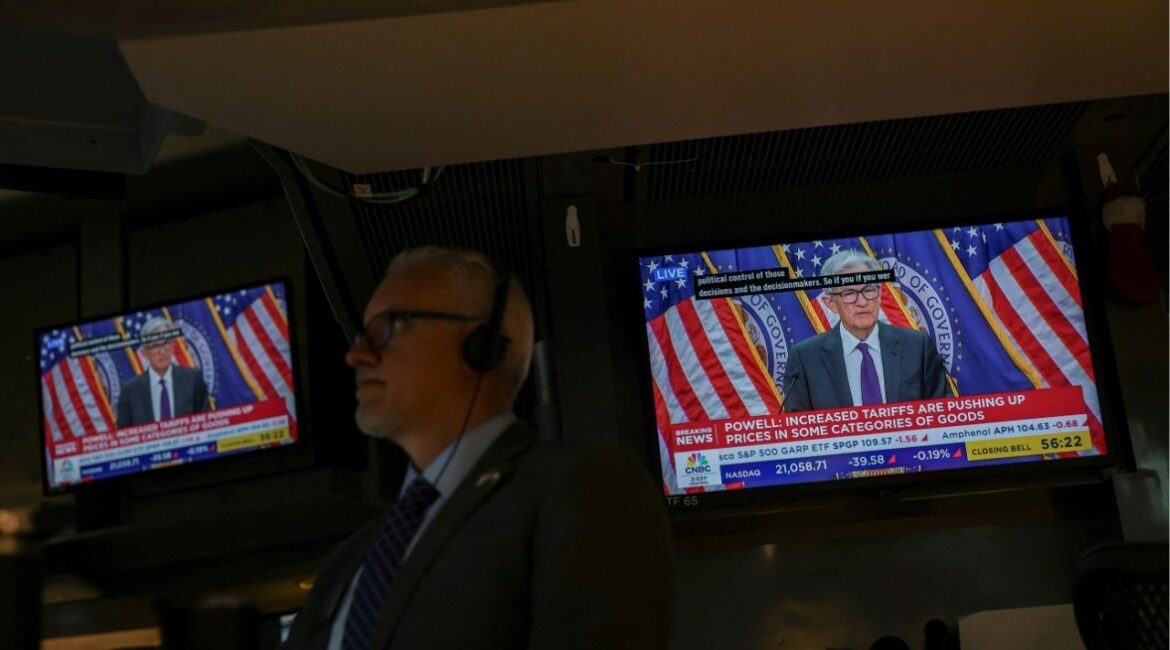 A trader works, as screens broadcast a press conference by U.S. Federal Reserve Chair Jerome Powell following the Fed rate announcement, on the floor of the NYSE in New York, U.S., July 30, 2025. (Reuters File)