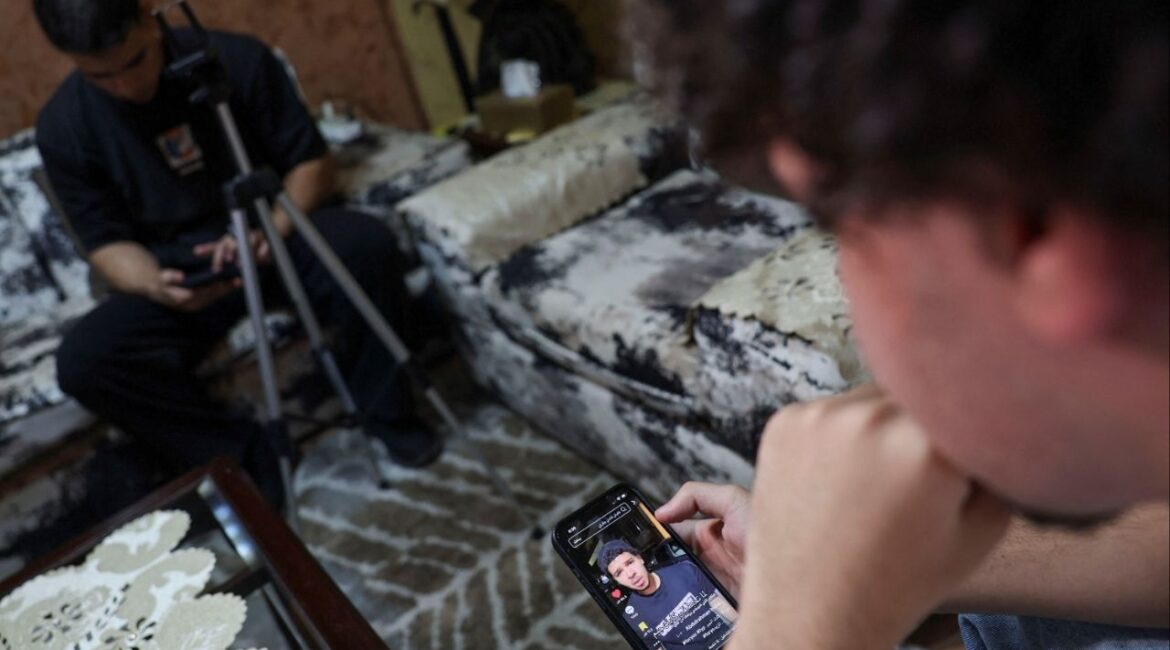 Abdulrahman Hisham, 20, an Egyptian social media content creator, looks at his page with several videos, amid a wave of cases prompting Egypt to consider tighter regulations on social media platforms at his residence in n Cairo, Egypt August, 20, 2025. REUTERS/Amr Abdallah Dalsh