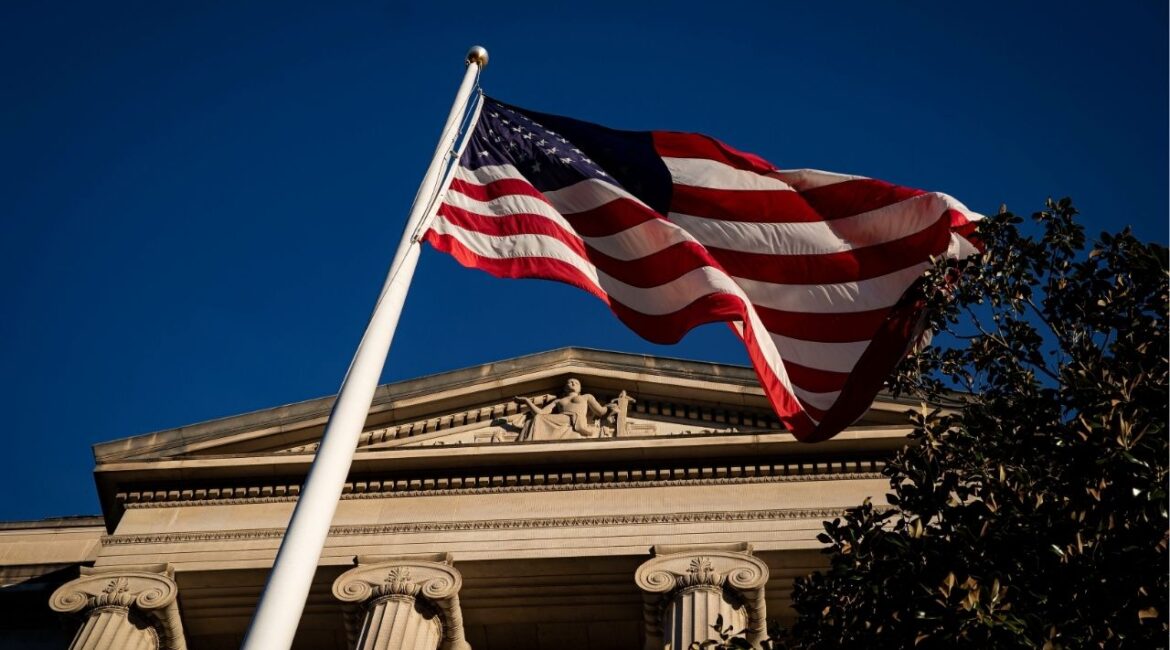 An American flag waves outside the U.S. Department of Justice Building in Washington, U.S., December 15, 2020. (Reuters File)