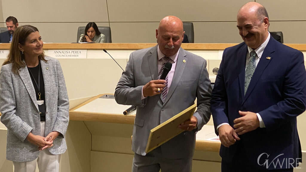 City Manager Georgeanne White and Mayor Jerry Dyer honor city independent reviewer John Gliatta.