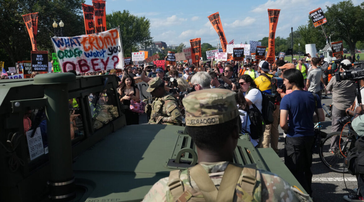 Protesters March in front of National Guard in Washington, D.C.