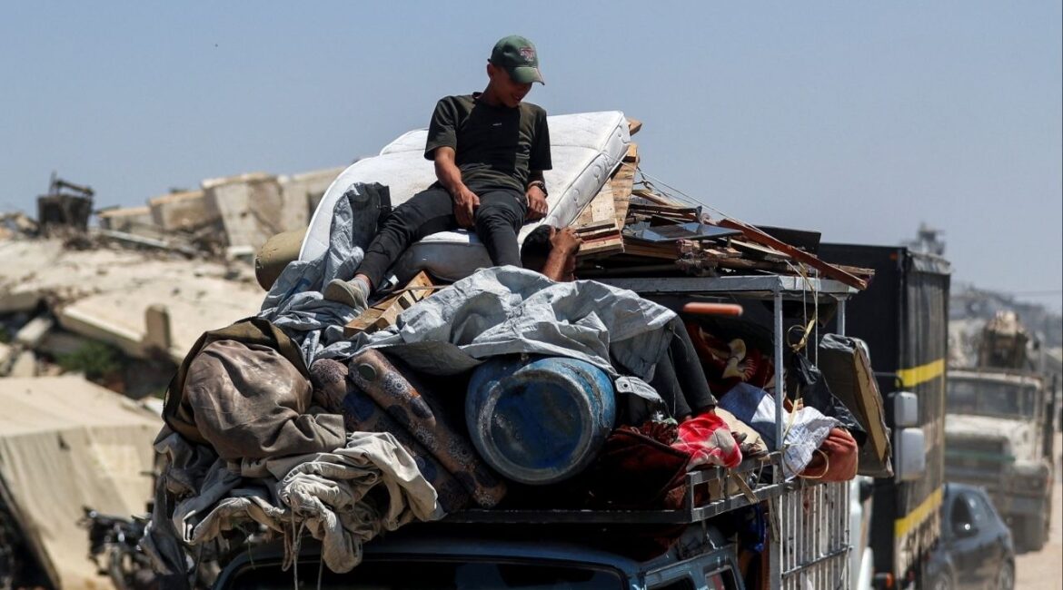 Displaced Palestinians fleeing northern Gaza travel in a vehicle while they head south as the Israeli military prepares to relocate residents to the southern part of the enclave, in Gaza City, August 18, 2025. (Reuters/Mahmoud Issa)