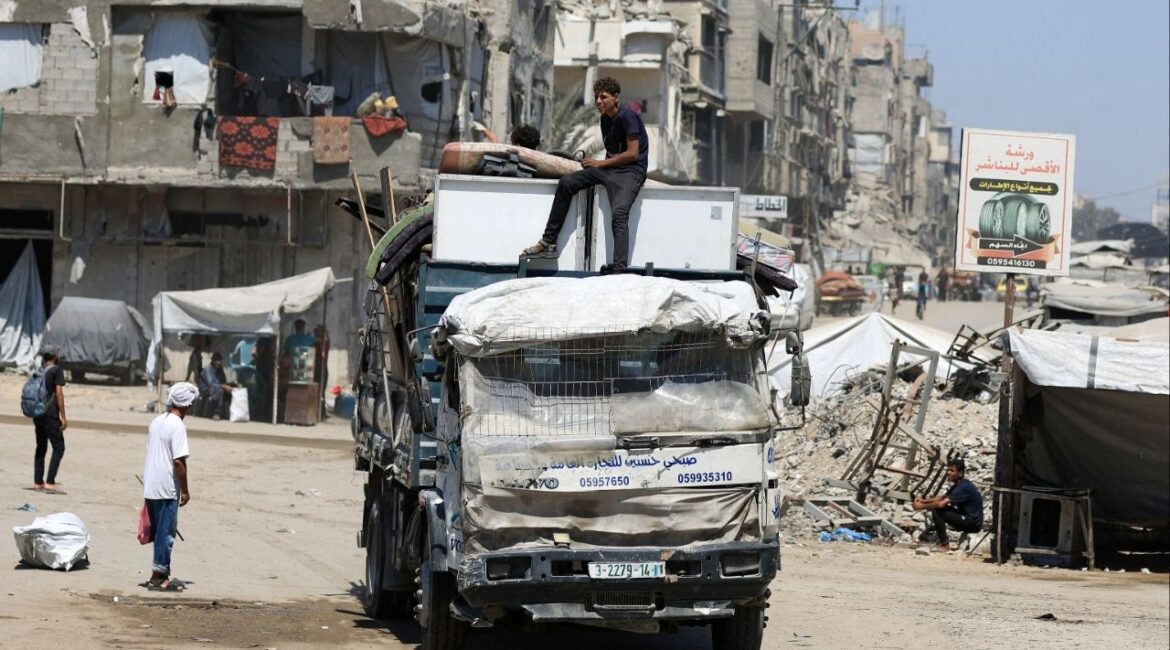 Displaced Palestinians ride on a vehicle loaded with belongings as they flee from one area to another within Gaza City, amid an Israeli military operation, in Gaza City, August 29, 2025. (Reuters File)