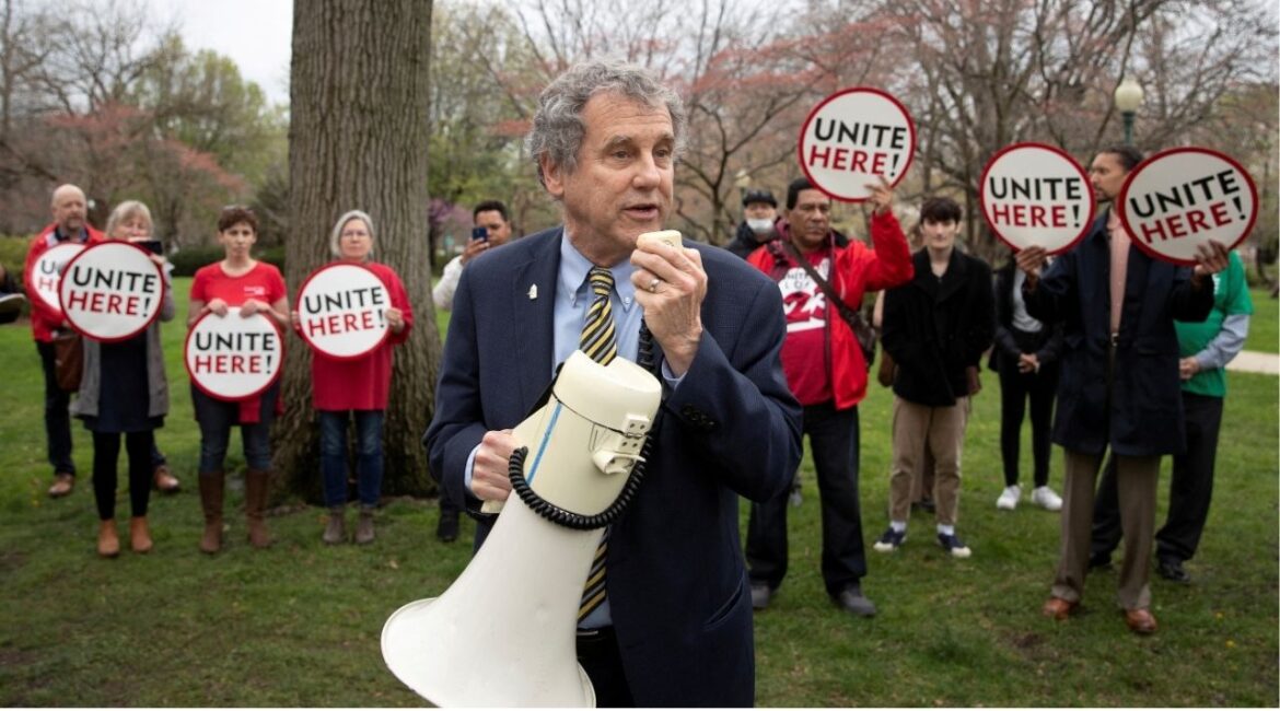 FILE PHOTO: U.S. Senator Sherrod Brown (D-OH) addresses members of the Local 23 and 25 food service and hospitality labor workers' unions during a picket line to protest against Capitol food service worker layoffs, on Capitol Hill in Washington, U.S., April 6, 2022. (Reuters File)