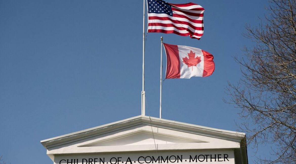 Flags fly above the Peace Arch, at a Canada-U.S. border crossing known as the Peace Arch Border Crossing in Blaine, Washington, U.S. April 2, 2025. (Reuters File)
