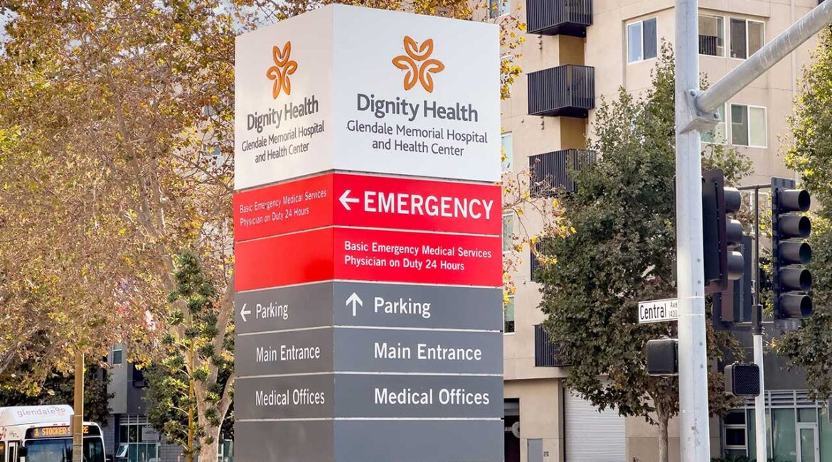 A view of a sign for the Dignity Health Glendale Memorial Hospital.