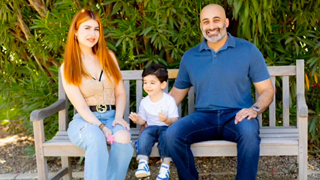Image of Psalm "Sam" Behpoor with his wife and son