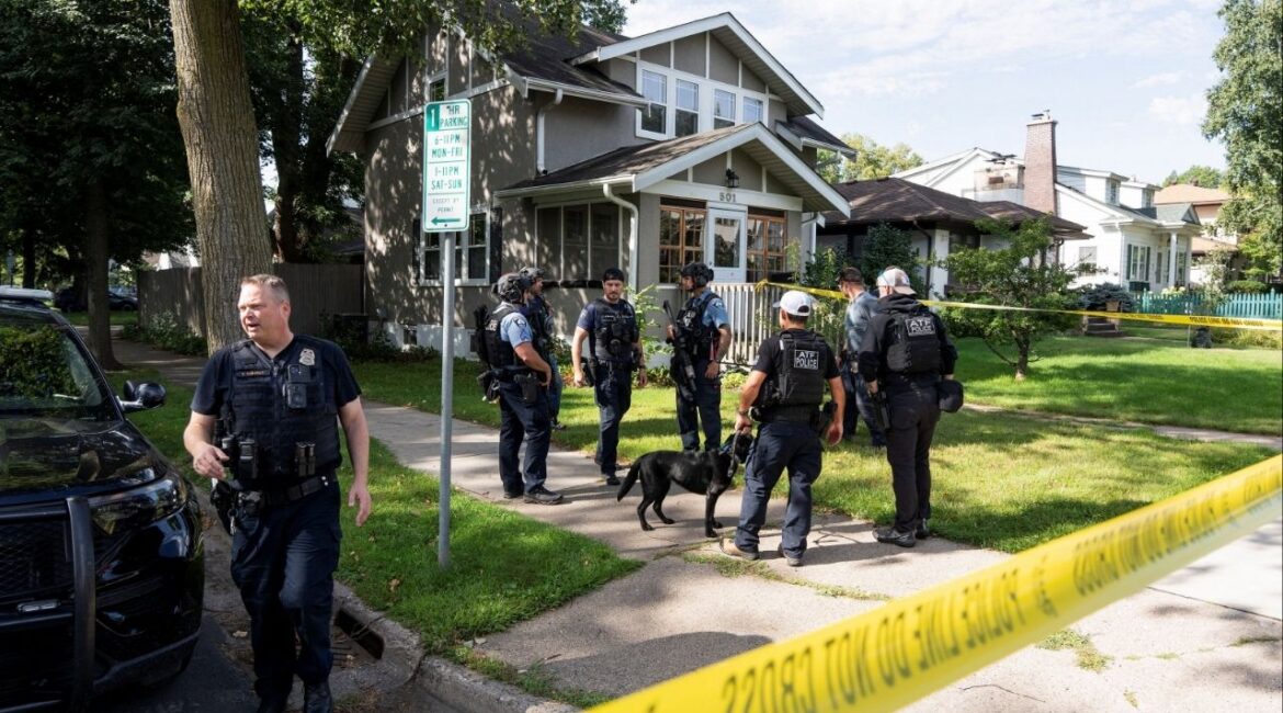 Law enforcement use K-9 dogs to search a nearby neighborhood, after a shooting at Annunciation Church, which is also home to an elementary school, in Minneapolis, Minnesota, U.S. August 27, 2025. REUTERS/Tim Evans
