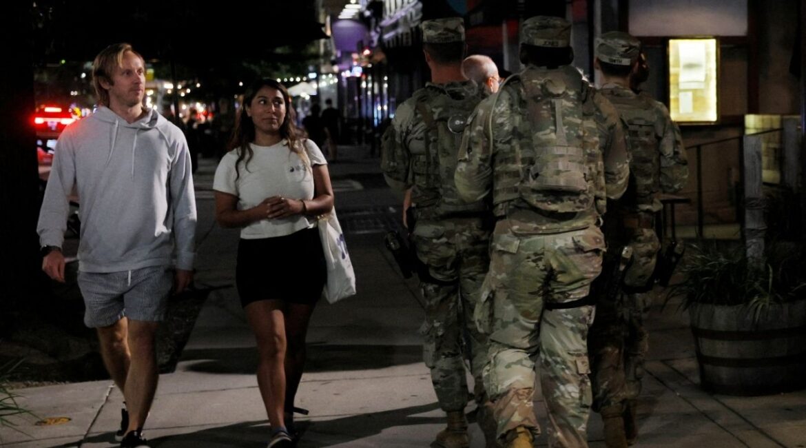 Members of the Ohio National Guard wear their sidearms while patrolling the Logan Circle neighborhood in Washington, D.C., U.S., August 24, 2025. (Reuters/Brian Snyder)