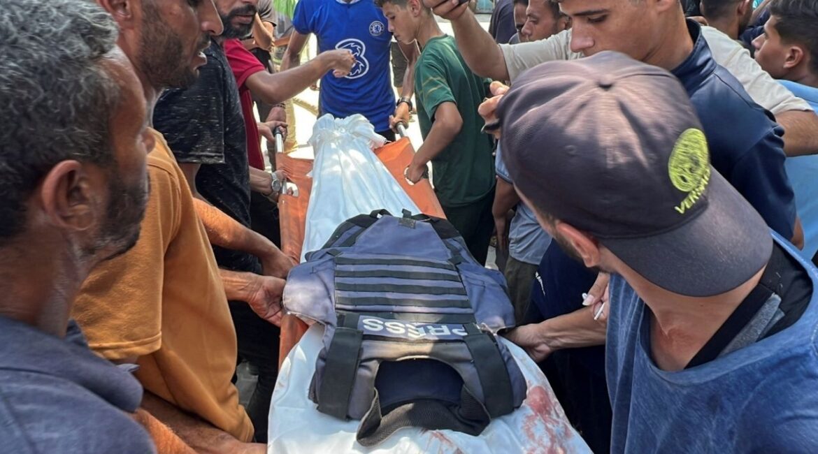 Mourners carry the body of Palestinian cameraman Hussam al-Masri, who was a contractor for Reuters, after he was killed along with other journalists and people in Israeli strikes on Nasser hospital, in Khan Younis in the southern Gaza Strip, August 25, 2025. REUTERS/Stringer