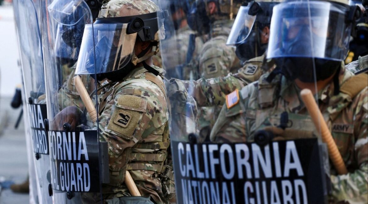 National Guard troops wear gas masks during protests against federal immigration sweeps, in Los Angeles, California, U.S., June 12, 2025. (Reuters File)
