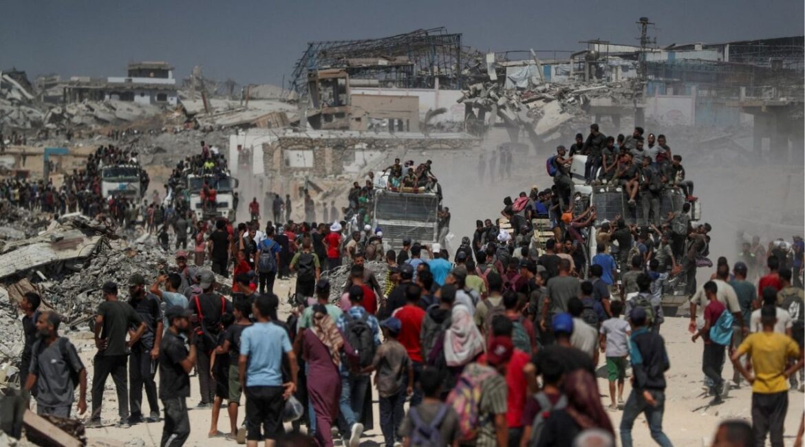 Palestinians climb onto trucks as they seek for aid supplies that entered Gaza through Israel in Beit Lahia, northern Gaza Strip, August 1, 2025. (Reuters File)