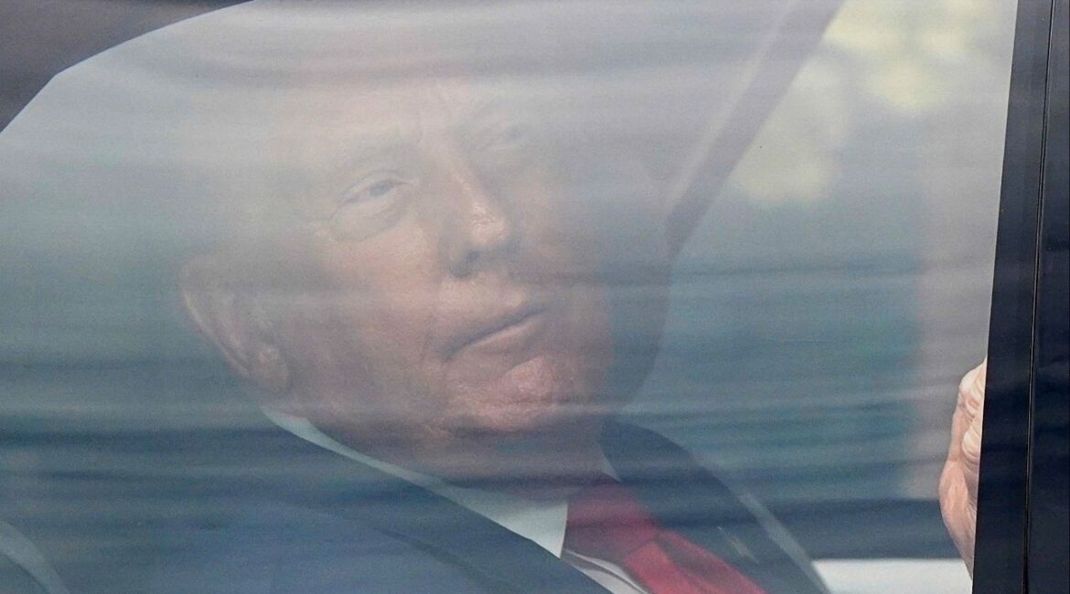 President Donald Trump travels in a vehicle as part a motorcade, as he returns to the White House from a visit to the Kennedy Center, in Washington D.C., U.S., August 13, 2025. (Reuters File)