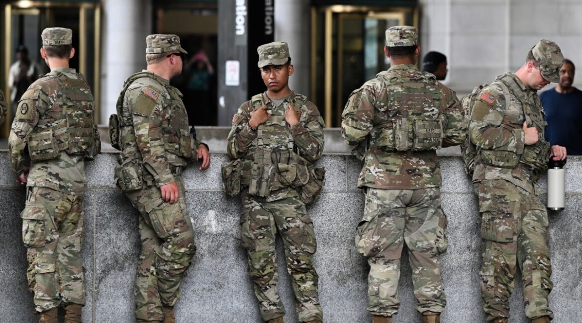 Soldiers with the 30th Armored Combat Brigade from the South Carolina National Guard at Union Station in Washington, Aug. 20, 2025. Defense Secretary Pete Hegseth has authorized National Guard troops deployed to Washington to bring their weapons with them on their mission. (Kenny Holston/The New York Times)